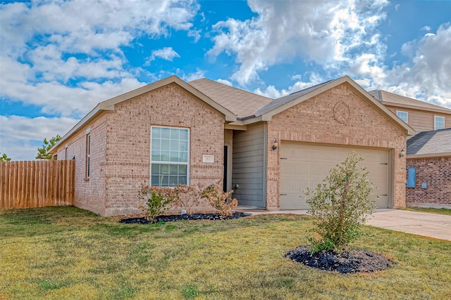 view of front of property with a front yard and a garage