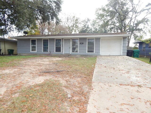 ranch-style home with a garage