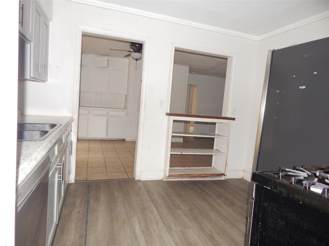 kitchen with white cabinets, crown molding, light hardwood / wood-style flooring, stainless steel dishwasher, and ceiling fan