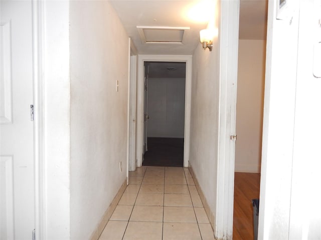 hall featuring light tile patterned floors