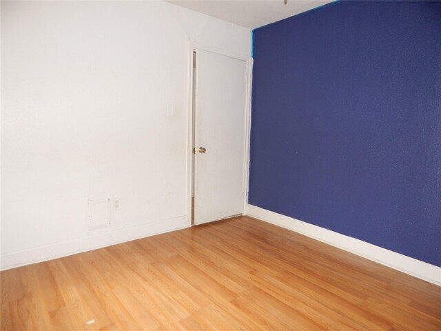 empty room featuring hardwood / wood-style floors