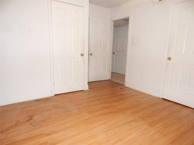 unfurnished bedroom with light hardwood / wood-style floors