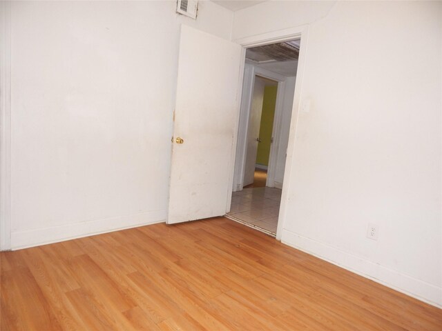 spare room featuring hardwood / wood-style flooring