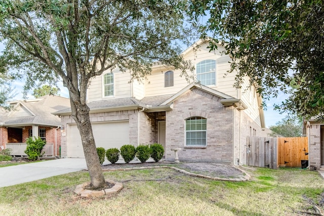 view of front of house featuring a garage and a front lawn