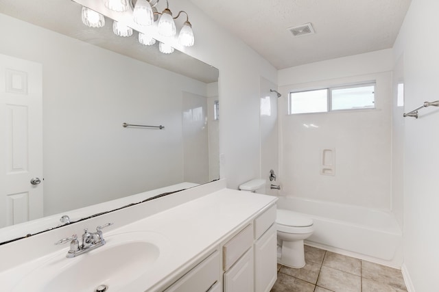 full bathroom with tub / shower combination, tile patterned floors, a textured ceiling, toilet, and vanity