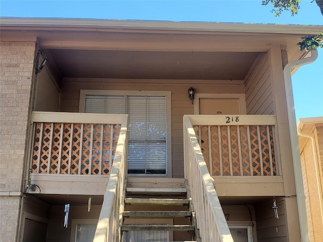 doorway to property featuring a balcony