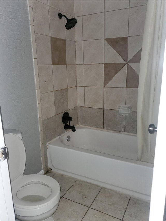 bathroom with toilet, shower / bath combo, and tile patterned floors