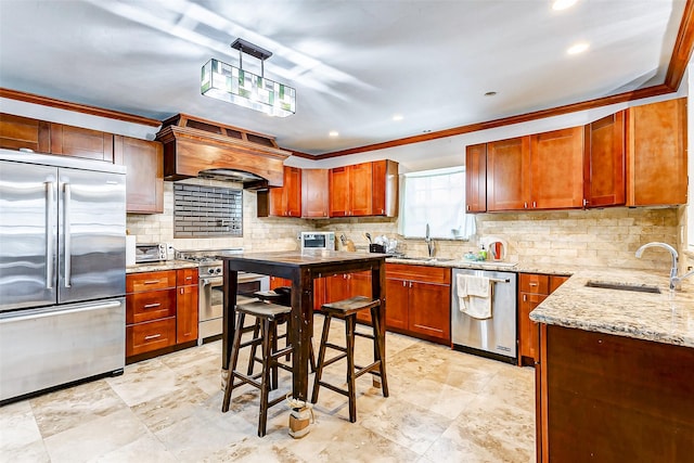 kitchen with crown molding, pendant lighting, custom exhaust hood, and appliances with stainless steel finishes