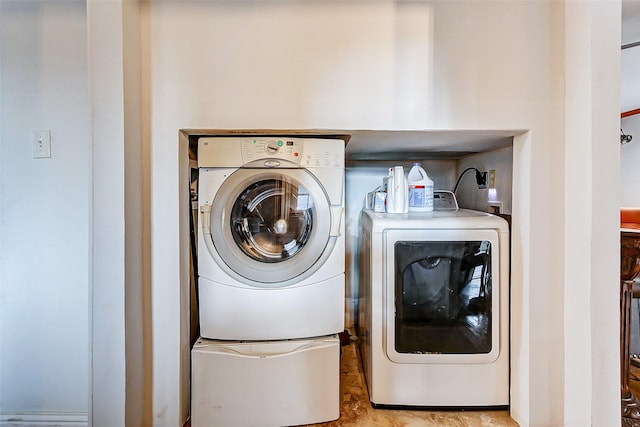 washroom featuring washer and dryer