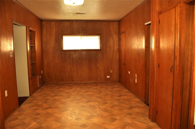 interior space featuring wooden walls