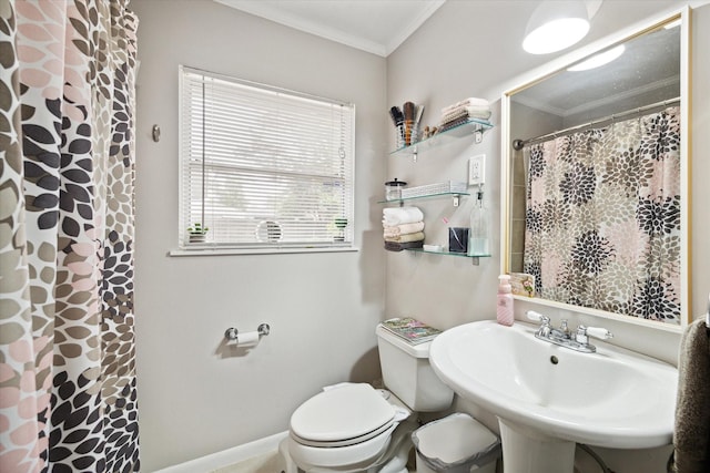 bathroom with walk in shower, crown molding, sink, and toilet