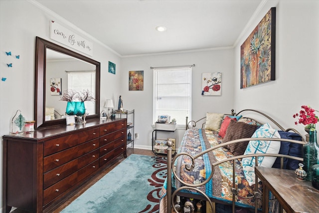 bedroom featuring wood-type flooring and crown molding