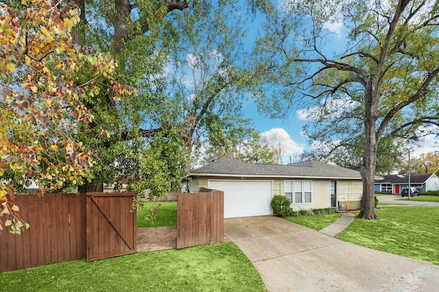 view of side of property featuring a yard and a garage