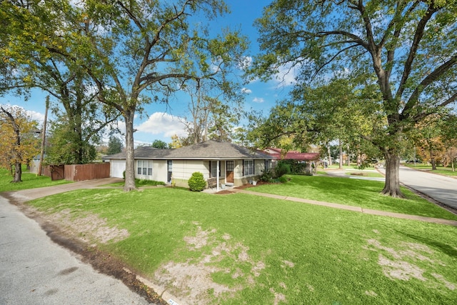 ranch-style home with a front yard