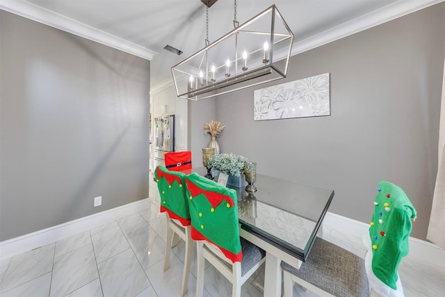 dining area featuring an inviting chandelier and ornamental molding