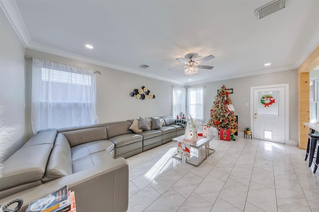 living room with ceiling fan and crown molding