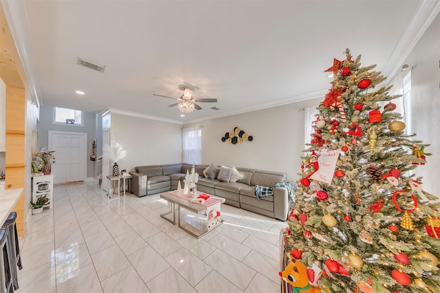 living room with light tile patterned floors, ceiling fan, and crown molding