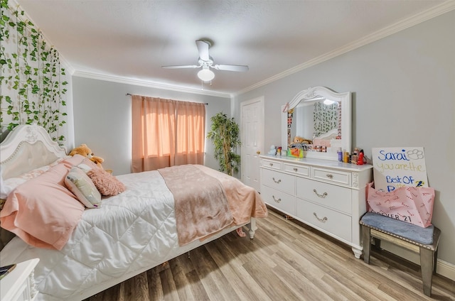 bedroom with ceiling fan, crown molding, and light hardwood / wood-style flooring