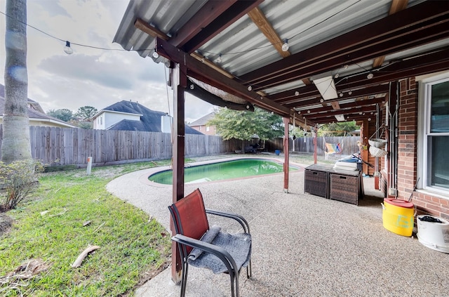 view of patio / terrace featuring a fenced in pool