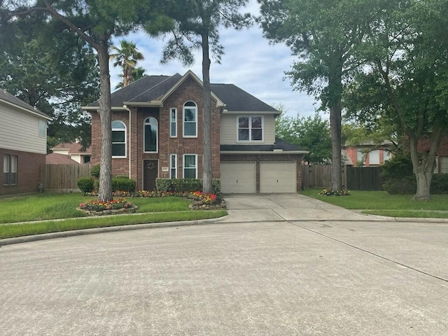 view of front of home featuring a front yard and a garage