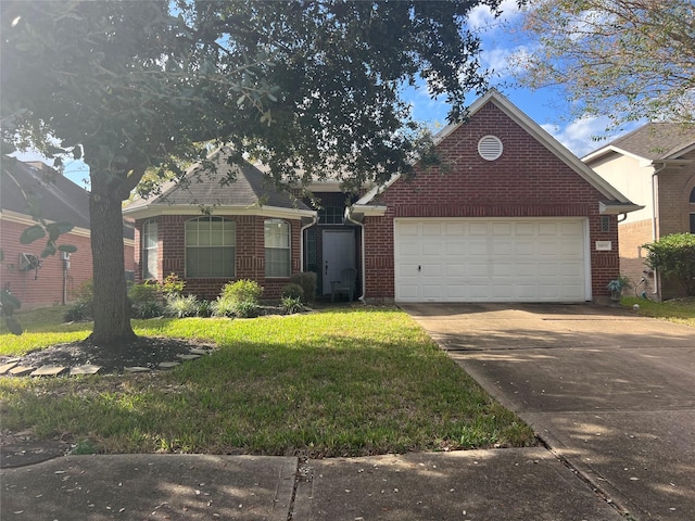 view of front of home featuring a garage and a front yard