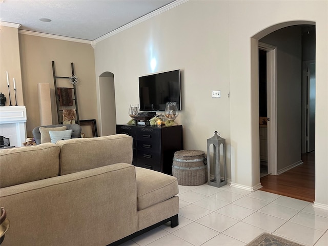 living room featuring crown molding and light hardwood / wood-style flooring