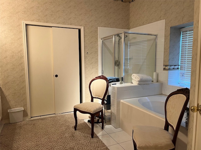 bathroom featuring tile patterned floors and shower with separate bathtub