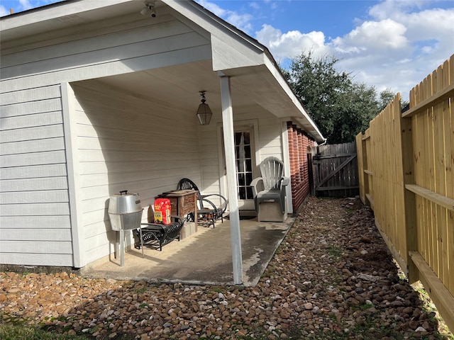 view of side of property featuring a patio