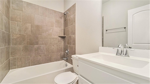 full bathroom featuring vanity, toilet, and tiled shower / bath