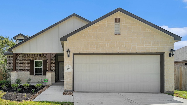 view of front of property with covered porch and a garage