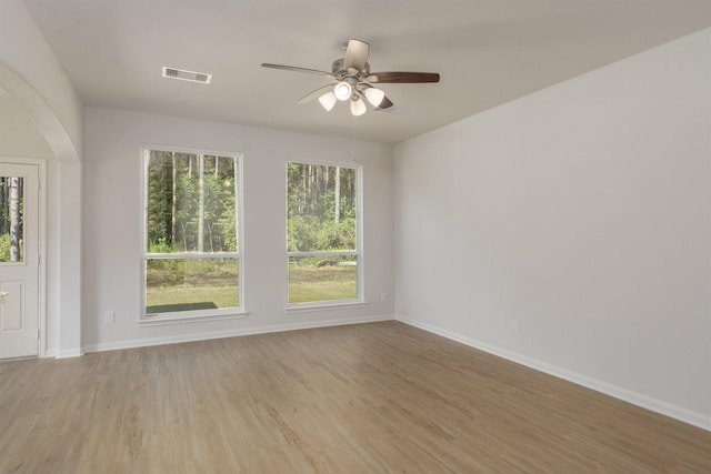 spare room with ceiling fan and light hardwood / wood-style flooring