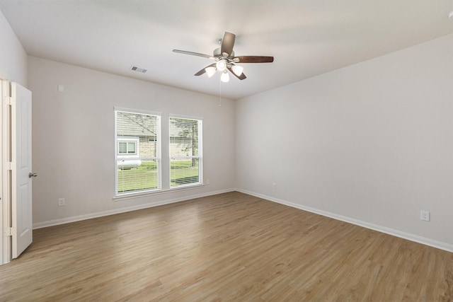 spare room featuring ceiling fan and light hardwood / wood-style flooring