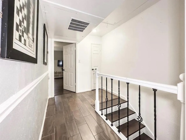 corridor featuring dark hardwood / wood-style flooring