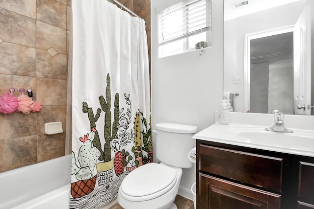 full bathroom with vanity, toilet, and shower / tub combo with curtain