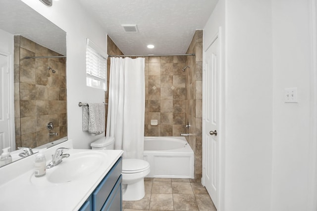 full bathroom with vanity, tile patterned flooring, toilet, a textured ceiling, and shower / tub combo with curtain