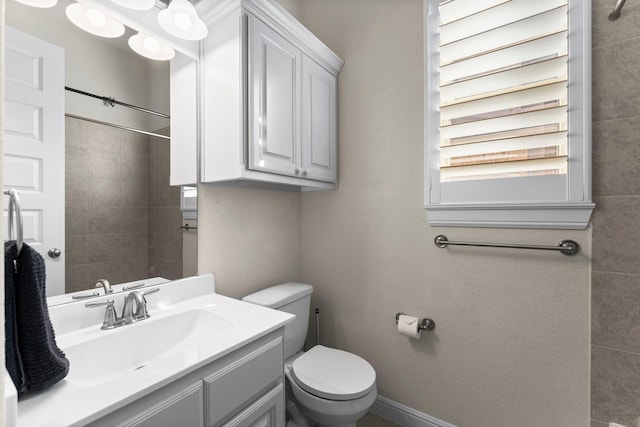 bathroom with vanity and toilet