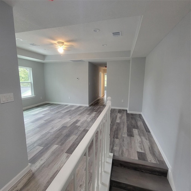 spare room featuring wood-type flooring