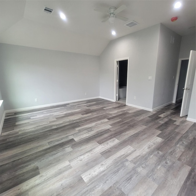 unfurnished room with hardwood / wood-style floors, vaulted ceiling, and ceiling fan