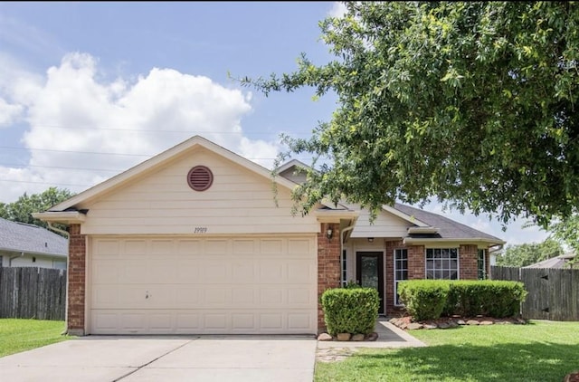 single story home featuring a front yard and a garage