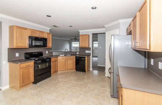 kitchen featuring black appliances, sink, ceiling fan, ornamental molding, and kitchen peninsula