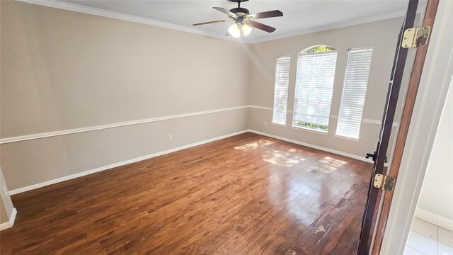 spare room featuring crown molding, ceiling fan, and hardwood / wood-style flooring