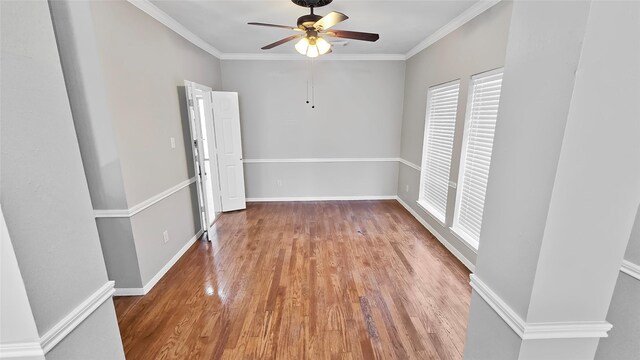 spare room with ceiling fan, ornamental molding, and hardwood / wood-style flooring