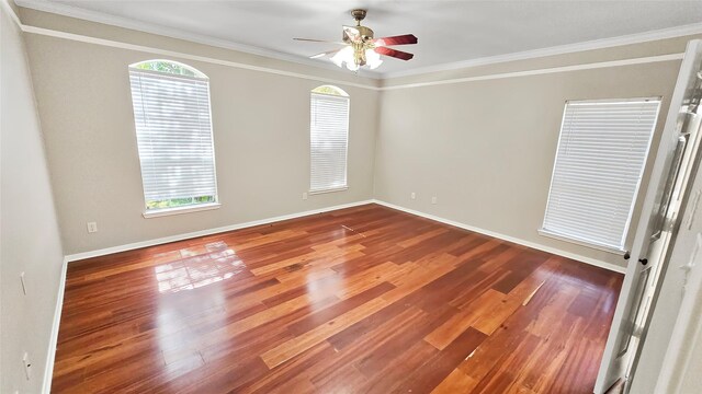 empty room featuring hardwood / wood-style floors, ceiling fan, and crown molding