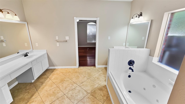 bathroom with tile patterned flooring, vanity, and a tub