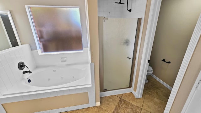 bathroom featuring shower with separate bathtub, toilet, and tile patterned floors