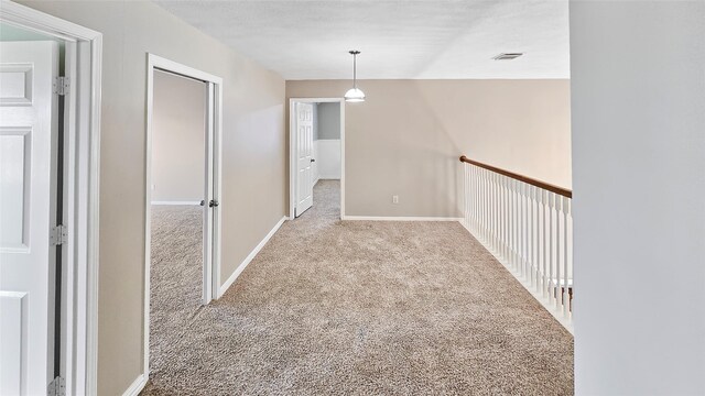 corridor featuring carpet flooring