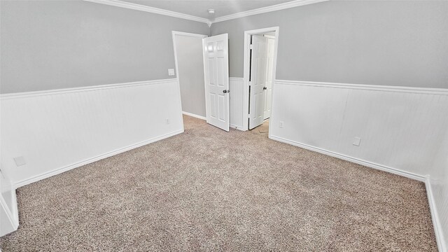 unfurnished room with light carpet and ornamental molding