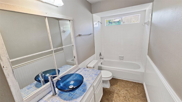 bathroom featuring tile patterned floors, vanity, and toilet