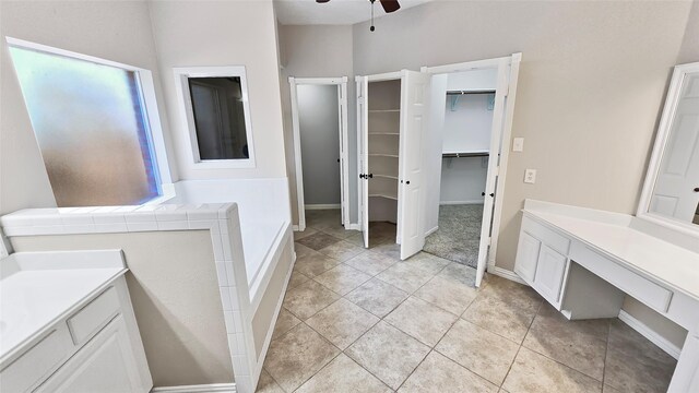 bathroom featuring ceiling fan, tile patterned flooring, and vanity