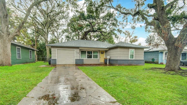 ranch-style house featuring a garage and a front yard